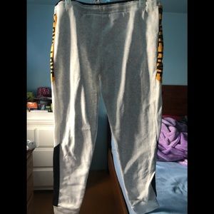 Light grey sweatpants with Love written on side